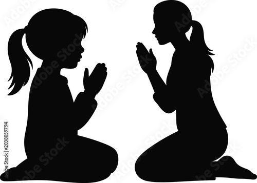 Fotografija Black silhouette illustration of a young girl and a woman kneeling and praying t