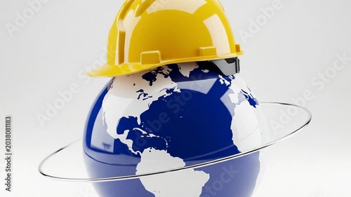 Earth globe wearing a yellow safety hard hat on white background