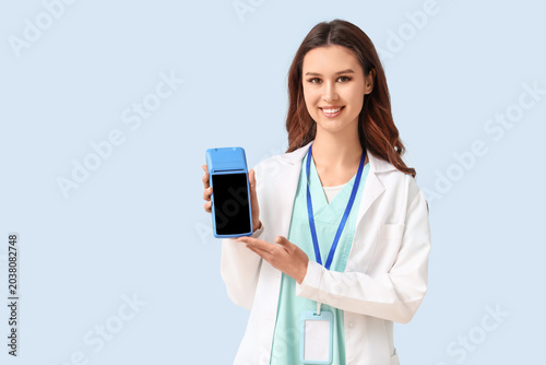 Female doctor with payment ...