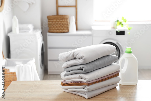 Stack of clean bed sheets a...