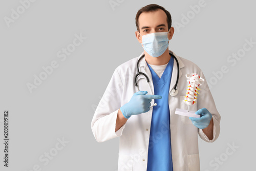 Male doctor pointing at spi...