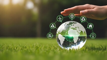 Net zero sustainability concept with glass globe, eco icons, grass field and protective hand