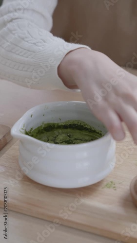 Traditional Matcha Tea Preparation with Bamboo Whisk and Teapot