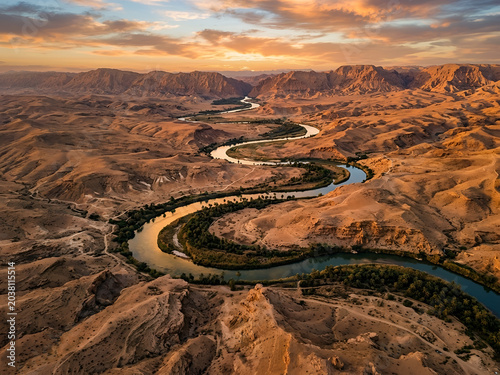 Euphrates River flowing through desert landscape at golden hour