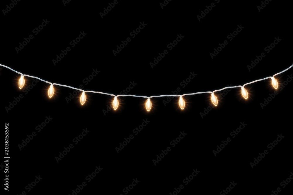 Fototapeta premium Warm white string lights glowing against a dark background