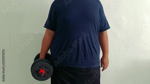Man Holding Dumbbell for Beginner Hammer Curl Workout