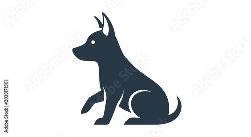 Tableau sur toile Black dog sitting profile view.
