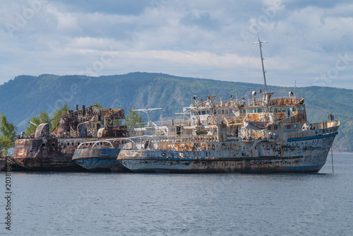 Old abandoned ships in the port on a cloudy September morning. Port Baikal, Irkutsk region