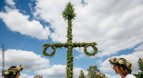 Traditional Midsummer Maypole Adorned with Greenery and Floral Wreaths.
