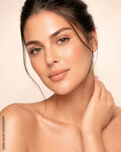 Close-up beauty portrait of a gorgeous woman with flawless glowing skin and natural pure makeup.
