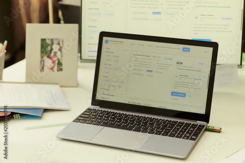 Close up of laptop displaying hotel booking platform on office desk  showing travel planning and online reservation workflow. Ideal for tourism marketing  booking app promotion