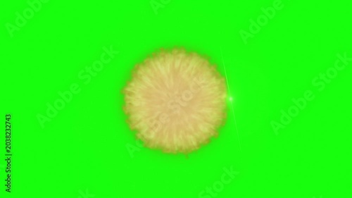 Explosion of golden and orange particles erupting from a central point on a vibrant green screen background creating a dynamic and energetic visual effect with a sense