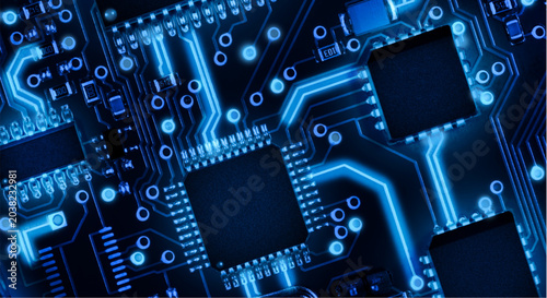 Glowing blue circuit board with microchips and electronic components close up