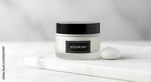 Cosmetic jar sits on a clean marble surface for product branding.