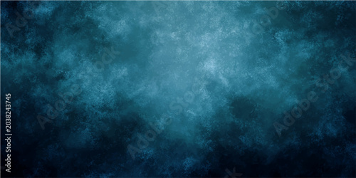 Fotografie Abstract texture of dark blue and turquoise clouds and mist with light and shadow play creating a dramatic and moody atmosphere suitable for background use