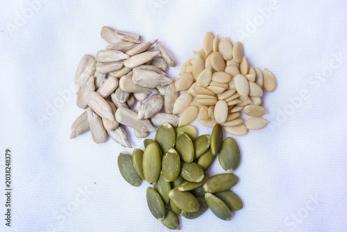 Foto Assortment of seeds on white background