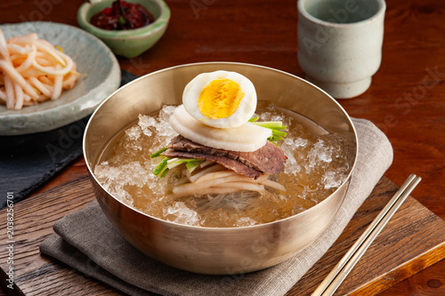 Traditional Korean Chilled Buckwheat Noodles, Mul-naengmyeon, with Beef Slices and Egg in Brass Bowl