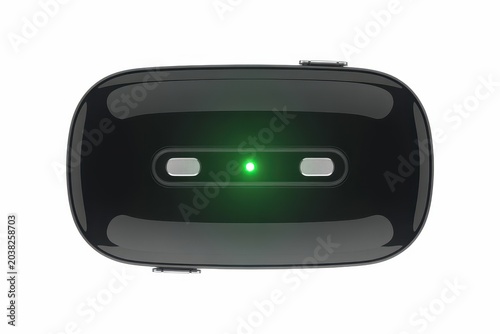 Black wireless remote control device with green power LED indicator isolated on white background