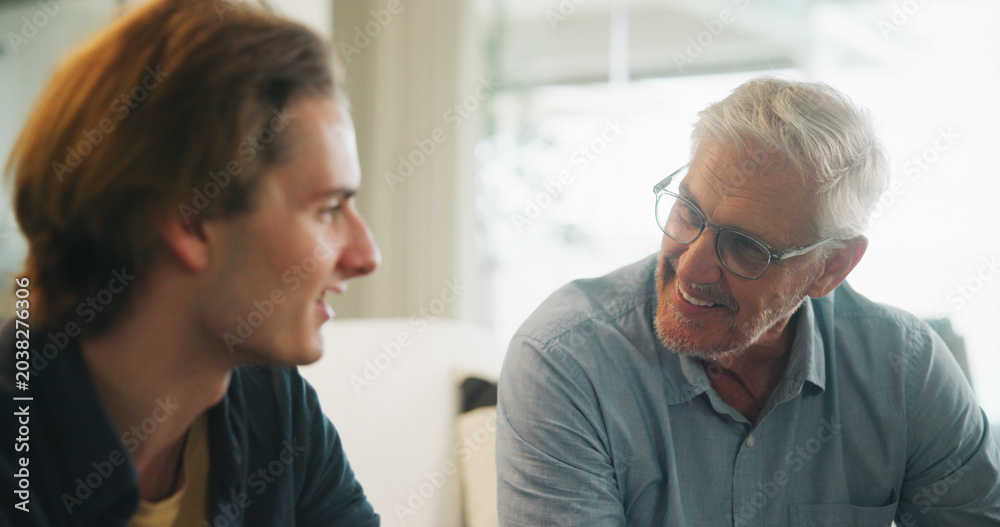 Fototapeta premium Love, home and elderly father with man for conversation, connection and bonding together on weekend. Senior dad, son or talking on sofa with parent for advice, smile and support in living room