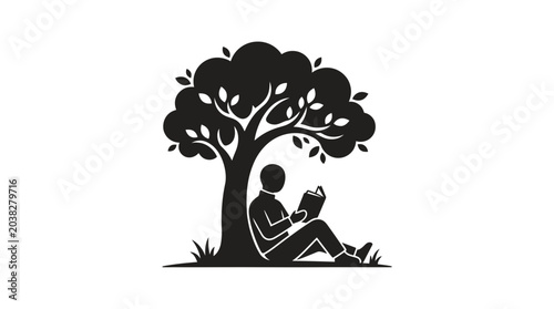 Bild auf Leinwand Person sitting under a tree while reading a book suggests a peaceful moment of quiet relaxation in nature