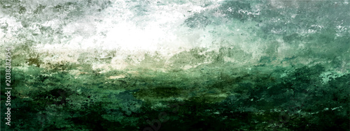 Bild auf Leinwand Emerald-green mountain range mist-shrouded, a breathtaking panorama