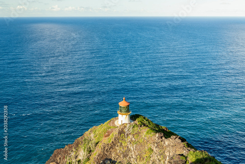 Schilderij op canvas The Makapuʻu Point Lighthouse under a blue sky in Hawaii