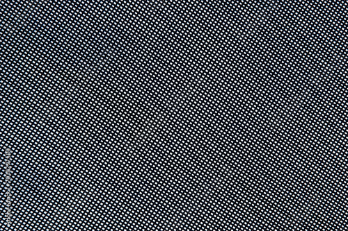 A close up texture of a fine black grid mesh screen showing tiny repeating white geometric square patterns.