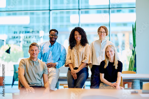 Photos Diverse business professionals feeling positive and collaborating in a modern co