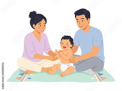 Happy family with mother father and baby sitting together on a floor mat playing together