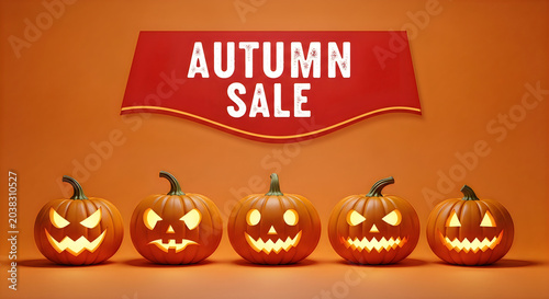 Autumn sale banner with carved pumpkins and seasonal lettering on orange background