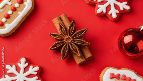 Gingerbread cookies with white icing and red ornaments
