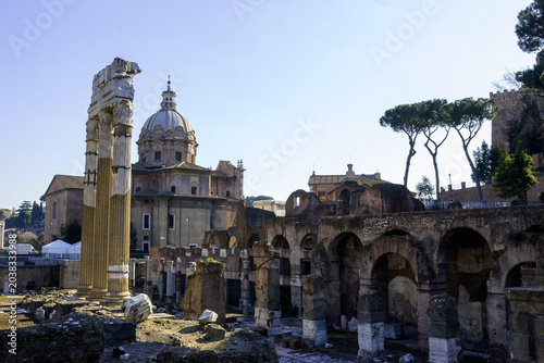 Ruins of the Roman Forum with the dome of Sant'Andrea della Valle in the background, Rome, Italy.