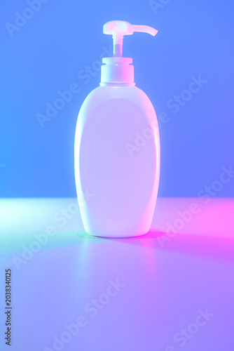 Object Series : White pump bottle illuminated by vibrant RGB cyberpunk neon aesthetic lights.