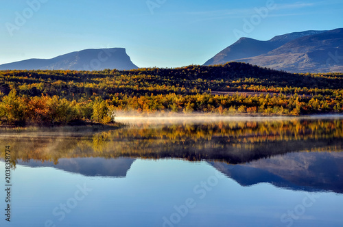 Sunrise lake in autumn. Abisko national park in north of Sweden.