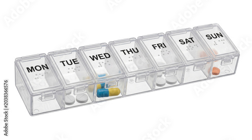 Weekly pill box with pills for each day of the week isolated on transparent background