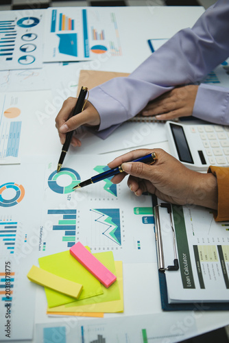 Auditor and accountant team working in office, analyze financial data and accounting record with calculator. Accounting company provide finance and taxation planning for profitable cash flow. Insight