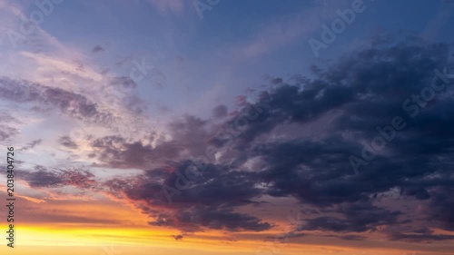 Dramatic sunset sky with vibrant orange and deep blue clouds