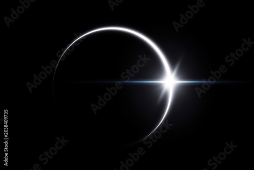 A stunning view of a celestial event with a crescent shape and bright starburst effect.