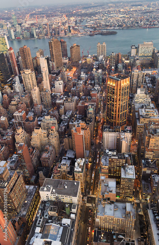 Aerial View of Midtown Manhattan Cityscape Looking East Toward River at Dusk