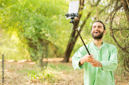 Bearded man taking selfie