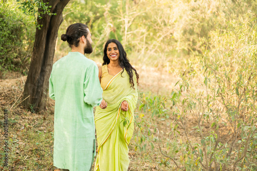 Indian couple talking in a forest