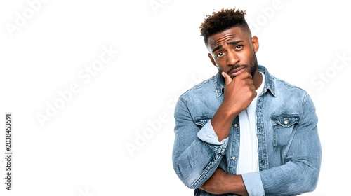 A person standing with hand on chin and a thoughtful look. Isolated on white background.