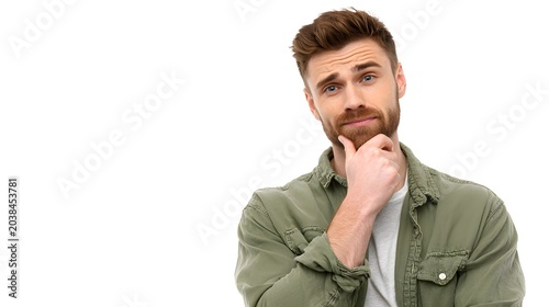 A person standing with hand on chin and a thoughtful look. Isolated on white background.