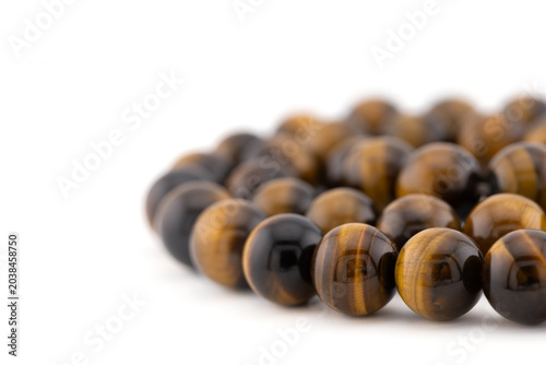 Tiger eye gemstone beads create versatile options for jewelry making, including bracelets and other handmade accessories. Ideal for DIY craft projects.