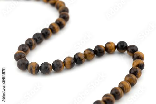 Tiger eye gemstone beads suitable for bracelet making and craft projects. Ideal for creating handmade accessories and unique jewelry items.