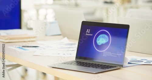 laptop screen displaying an Artificial Intelligence assistant program on office desk. Concept of smart workplace, automated business technology, generative AI integration, future corporate software.
