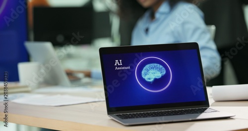 laptop screen displaying an Artificial Intelligence assistant program on office desk. Concept of smart workplace, automated business technology, generative AI integration, future corporate software.