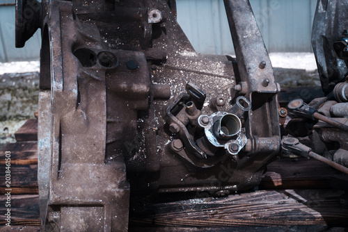 manual transmission from an old front-wheel drive car removed for cleaning and washing, repair and replacement of oil seals