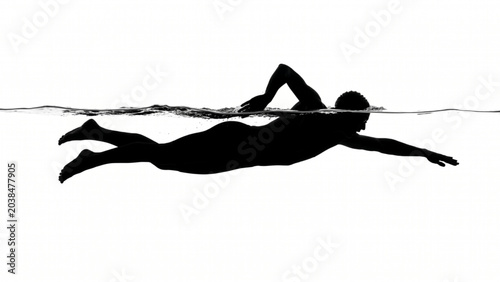 Photos Silhouette of a professional swimmer swimming freestyle in water
