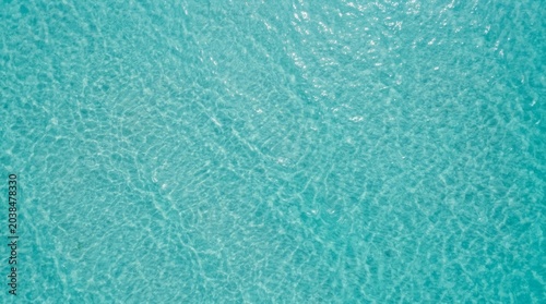 Crystal Clear Ocean Water Surface Water Turquoise Sea Aerial Surface Ripples Tranquil. Concept featuring water, turquoise, sea, aerial, surface for professional commercial design.